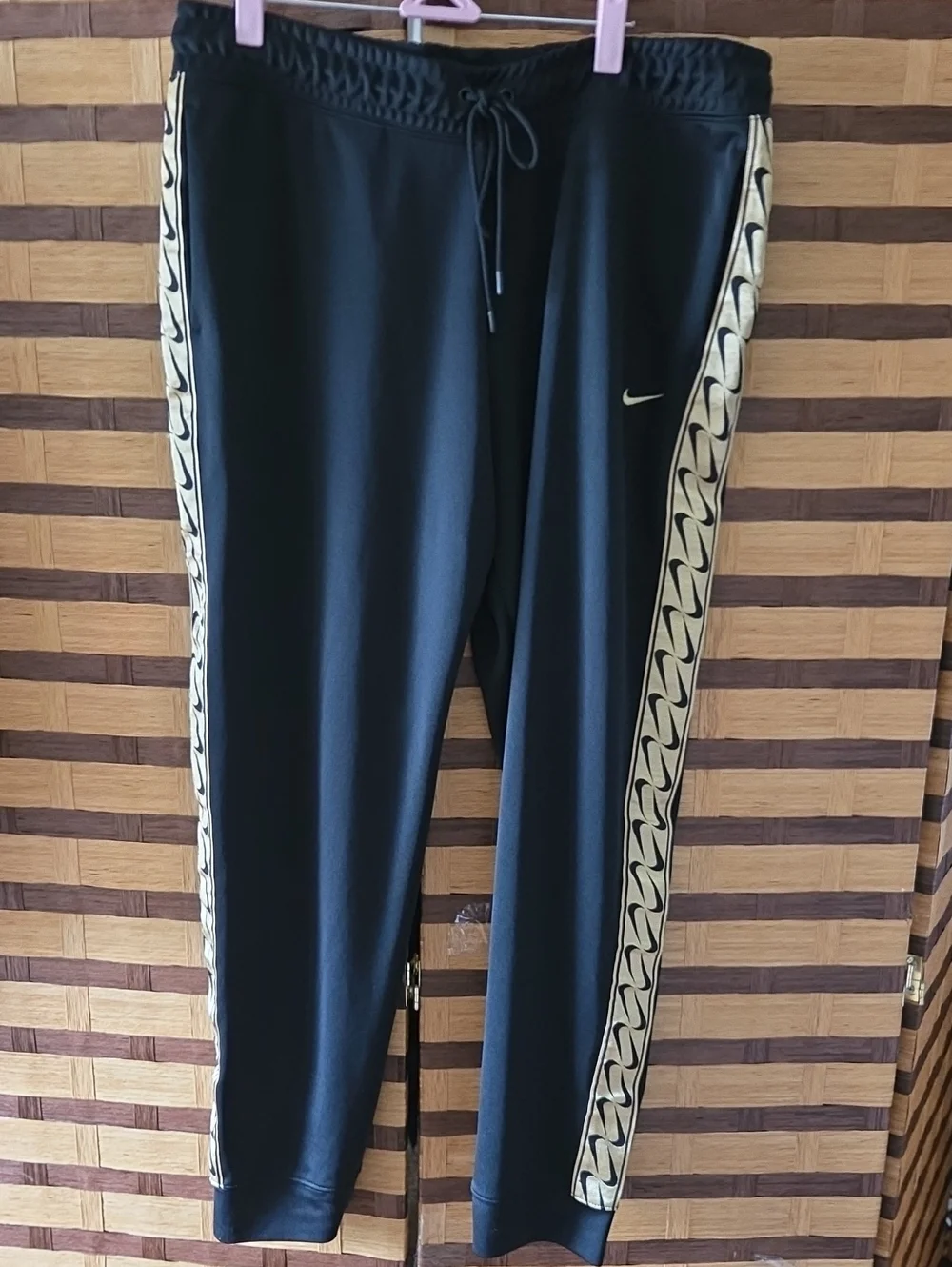 Nike  Black Track Pants with Contrasting Gold Side Stripe